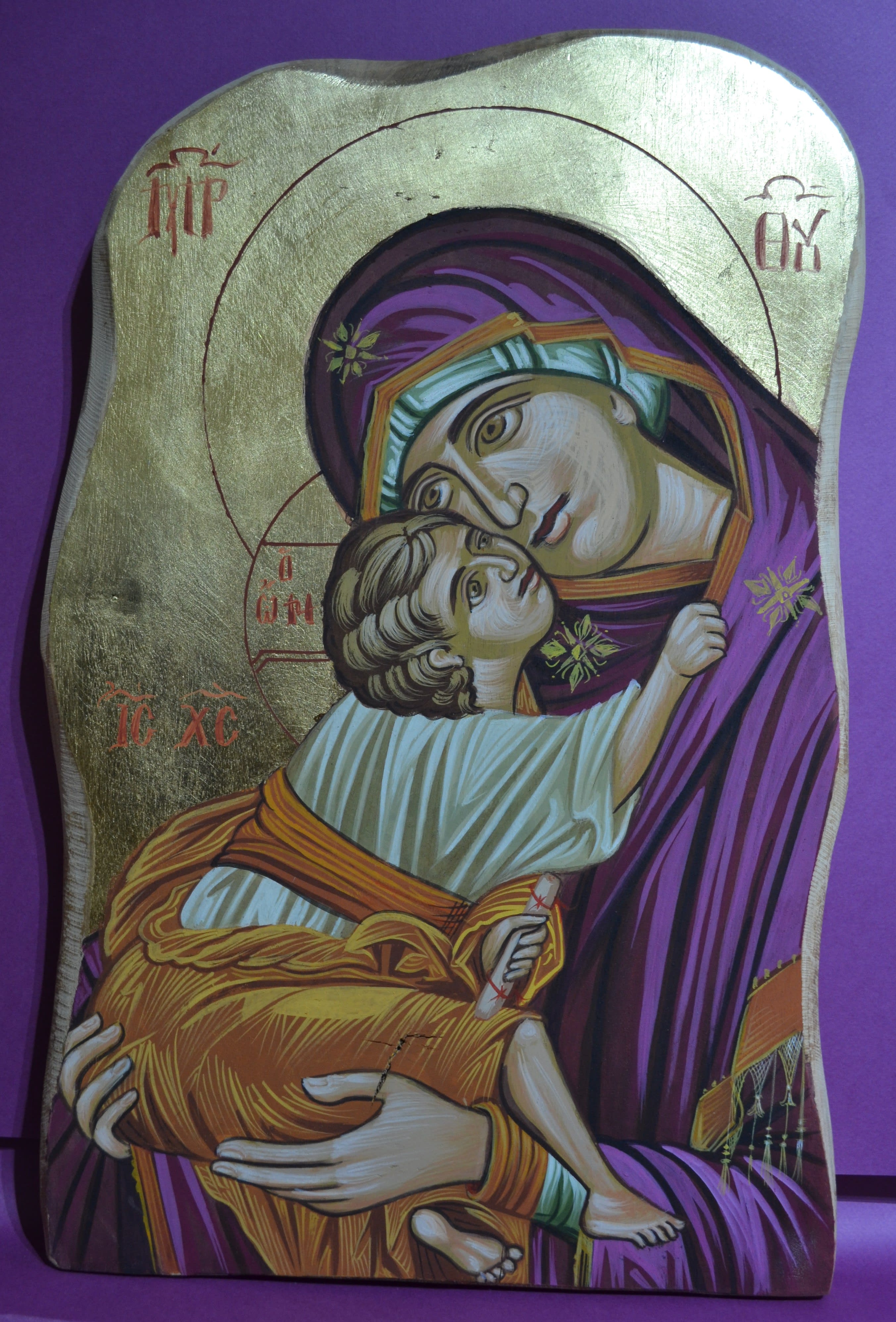 Byzantine Icon of Holy Mary embracing the small Christ, closely in her hands